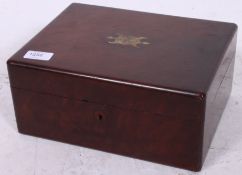 A Victorian mahogany workbox having a le