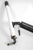 A 20th century telescope in white comple
