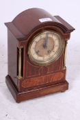 An Edwardian mahogany inlaid and brass b