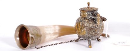 A decorative silver plated shot horn tog