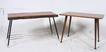 A 1950's walnut coffee table raised on t