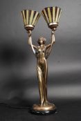 A large art deco style lamp with twin la