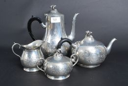 A silver plate / pewter four piece tea s