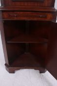 A good quality flame mahogany corner cab