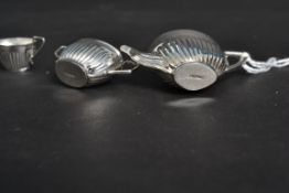 A decorative 20th century three piece si