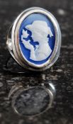 A white metal 925 silver cameo set ring.