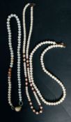 A necklace with three rows of pearls.