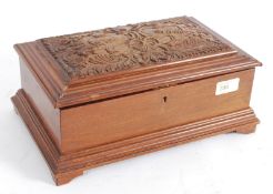 An ornately carved wooden jewellery box