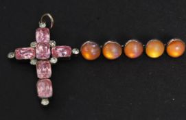 A silver crucifix having rose quartz sto