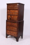 A 1920's country oak tallboy chest on ch