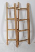 A pair of vintage wooden mini ladders be