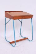 A retro 1950's childs school desk raised