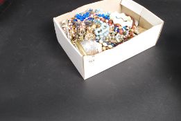 A box of assorted vintage costume jewell