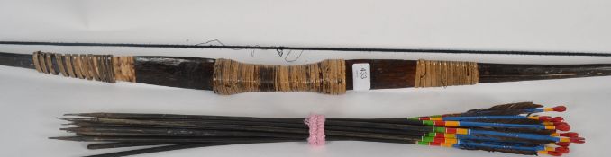 A vintage bow together with arrows being