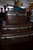 A retro stack of three matching suit cas