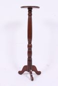 A Victorian mahogany torchere  / plant s