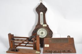 2 vintage pipe smokers stands, one in th