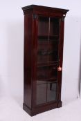 A good Victorian tall mahogany library bookcase cabinet having plinth base with full length astragal
