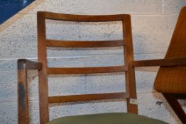 A Gordon Russell oak armchair. Raised on