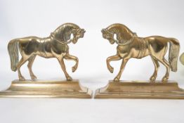 A pair of Victorian brass fireside ornam