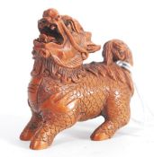 A Japanese oriental carved wood netsuke