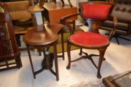 An Edwardian mahogany inlaid kidney shap