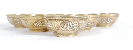 A set of 6 Arabic silver and copper inla