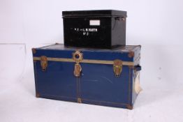 Two vintage metal steamer trunks both wi