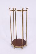 A contemporary antique style brass umbre