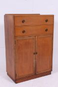 A 1930's oak tallboy chest of drawers.