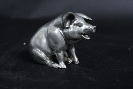 A 20th century white metal statue/ figur