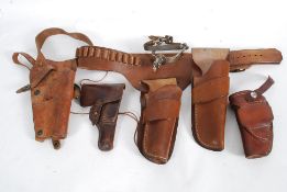 A collection of 20th century leather gun