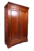 A 19th century French fruitwood armoire