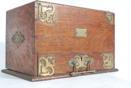 A Victorian oak and brass bound metamorp