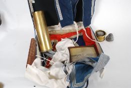 A vintage suitcase with items pertaining