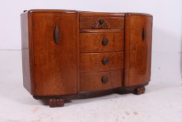 A 1930's Art Deco oak sideboard having b