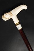 A Walking stick with bone handle in the