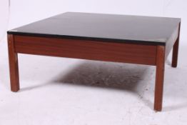 An retro coffee table having an ebonised
