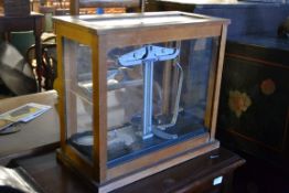 A vintage set of cased weighing scales b