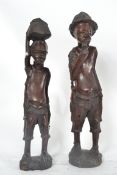 A pair of African tribal figurines havin