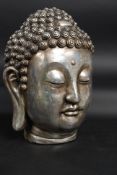 A 20th century faux stone large buddhas