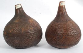 2 large hand carved gourds of oversize b