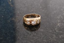 An 18ct gold and diamond 3 stone ring. T