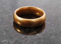 A 22ct gold gentlemans band ring being h