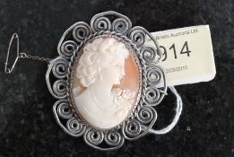 A ladies silver cameo brooch having scro