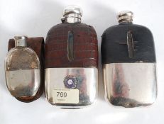 A collection of silver plated hip flasks