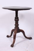 A late 18th century tilt top wine table