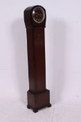 A 1950's oak grandmother clock, complete