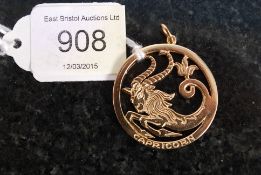 A 14ct gold ladies Capricorn necklace pe