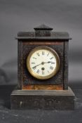 A Victorian slate mantle clock having in